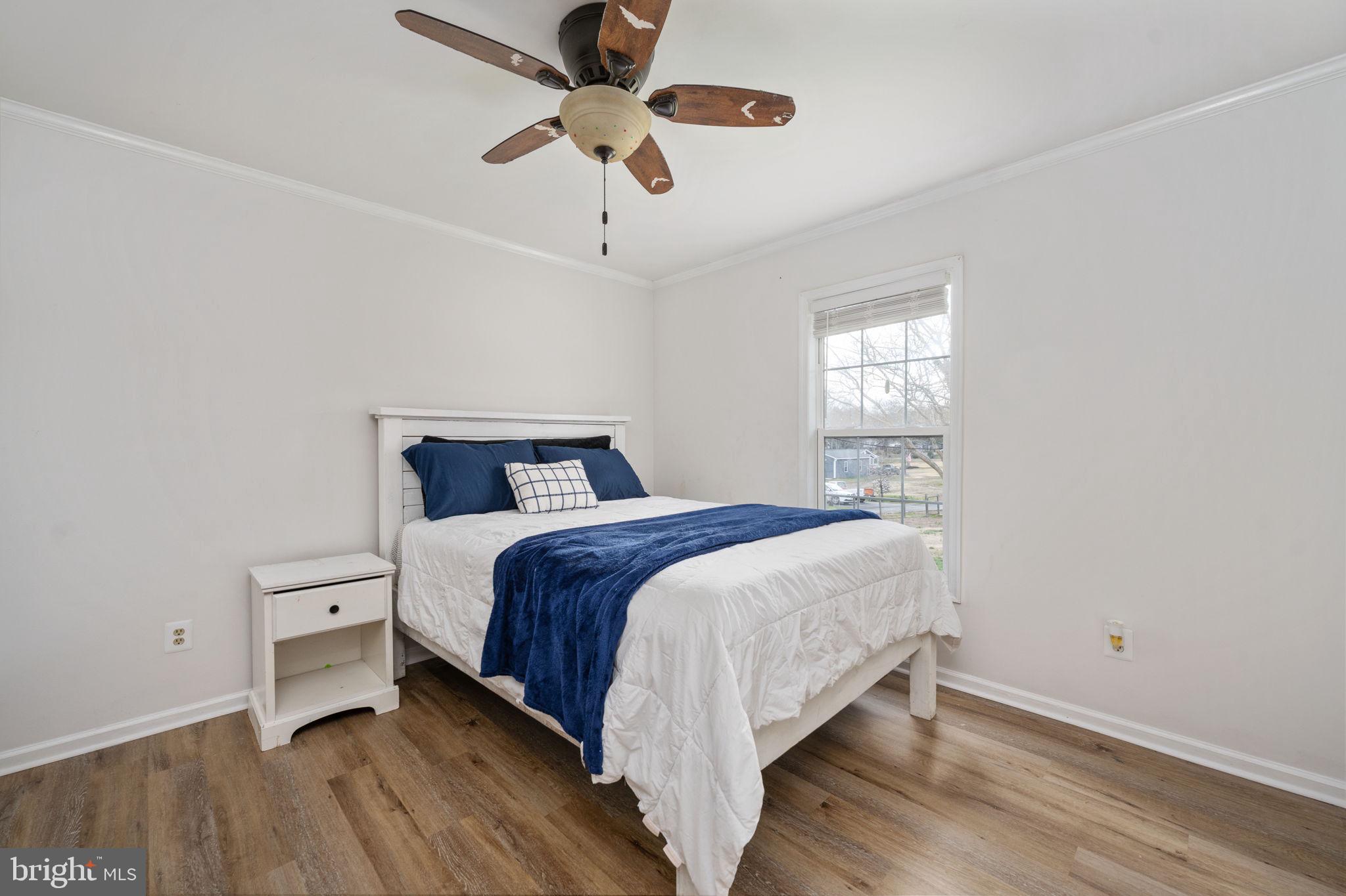 371 Greenbank Road Fredericksburg, VA 22406 - Photo 28 of 54 a bedroom with a bed and a ceiling fan