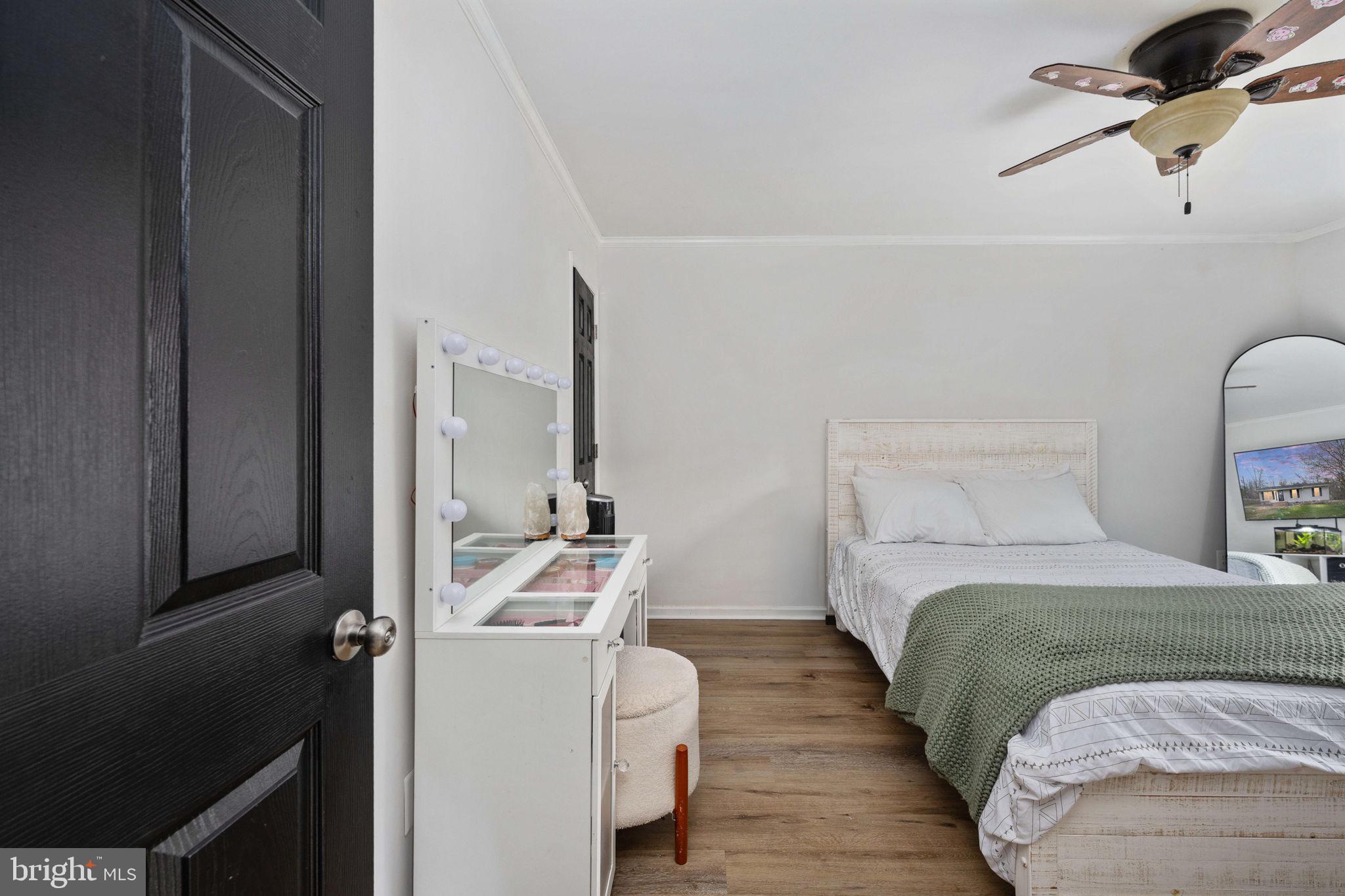 371 Greenbank Road Fredericksburg, VA 22406 - Photo 29 of 54 a bedroom with a bed and a table