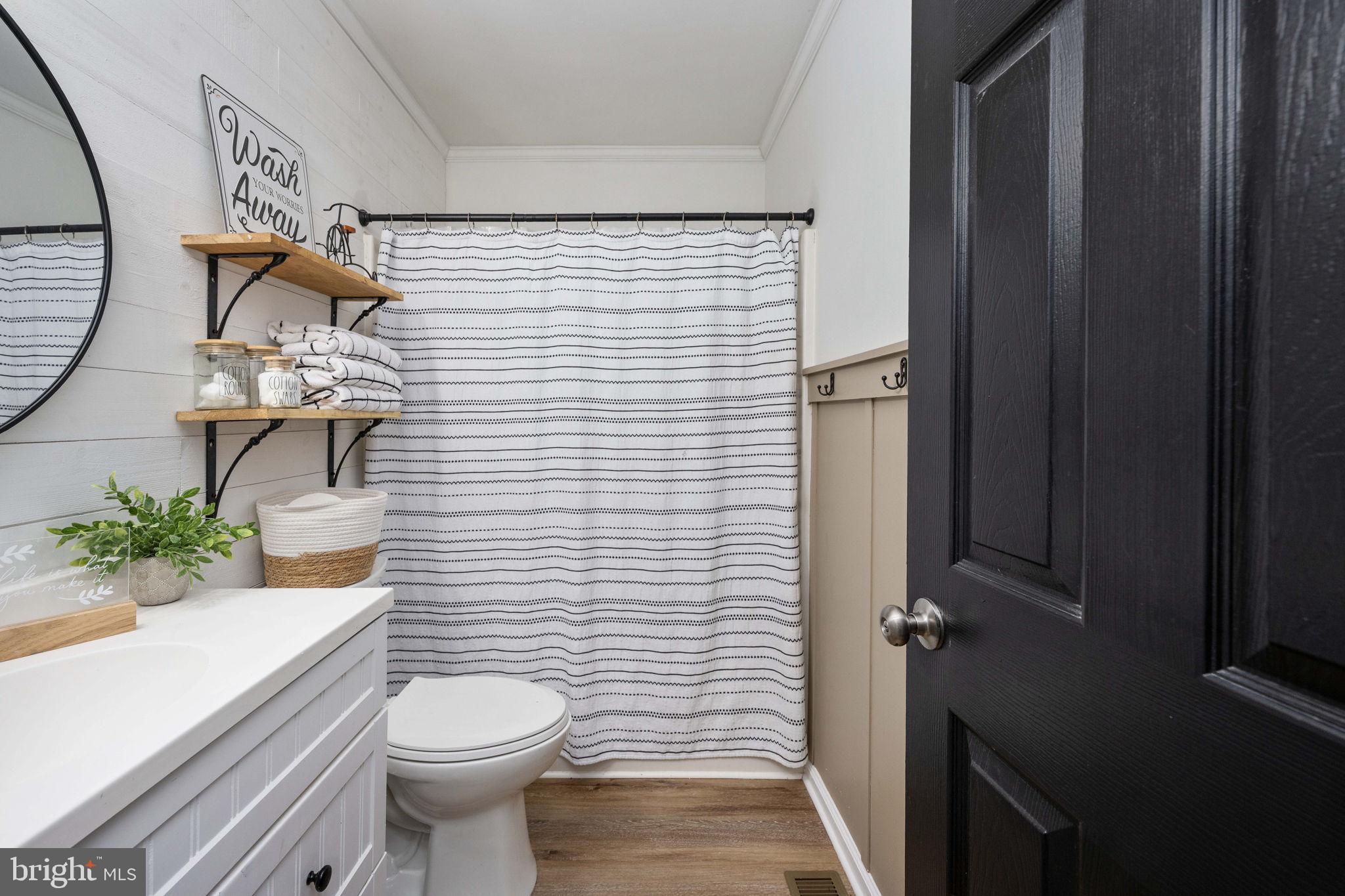 371 Greenbank Road Fredericksburg, VA 22406 - Photo 30 of 54 a bathroom with a sink toilet and mirror