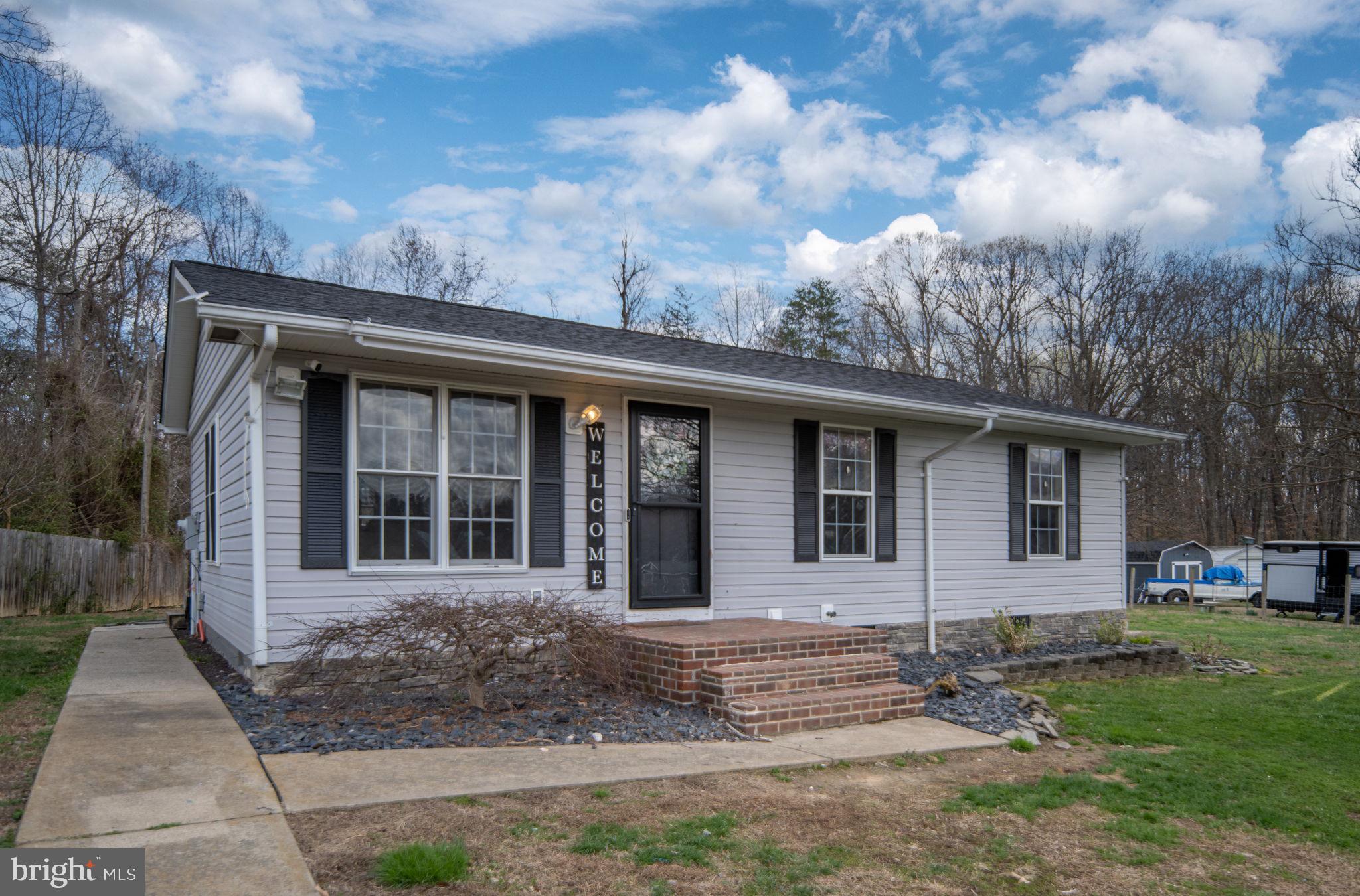 371 Greenbank Road Fredericksburg, VA 22406 - Photo 5 of 54 a front view of a house with garden