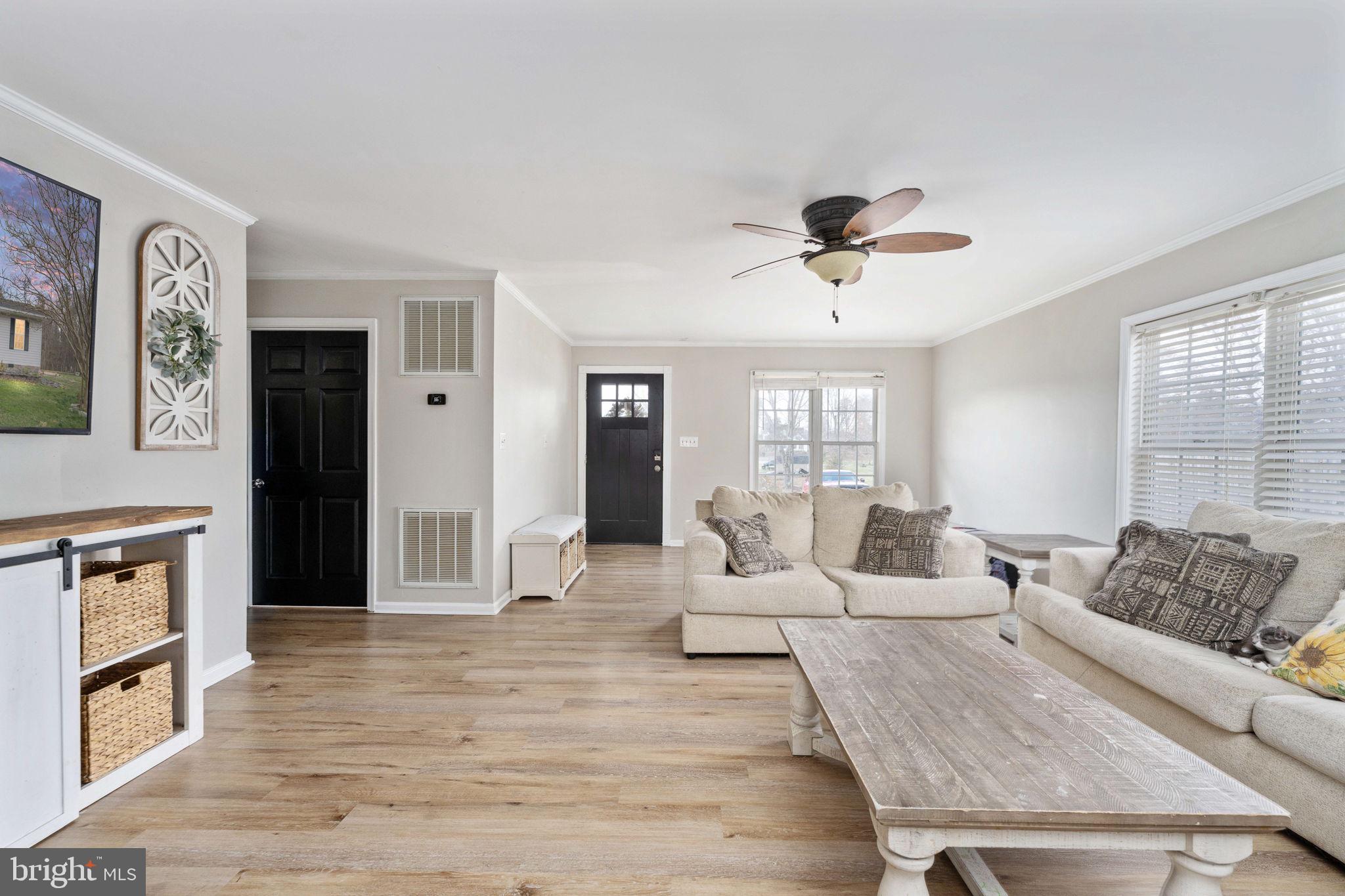371 Greenbank Road Fredericksburg, VA 22406 - Photo 10 of 54 a living room with furniture and a wooden floor