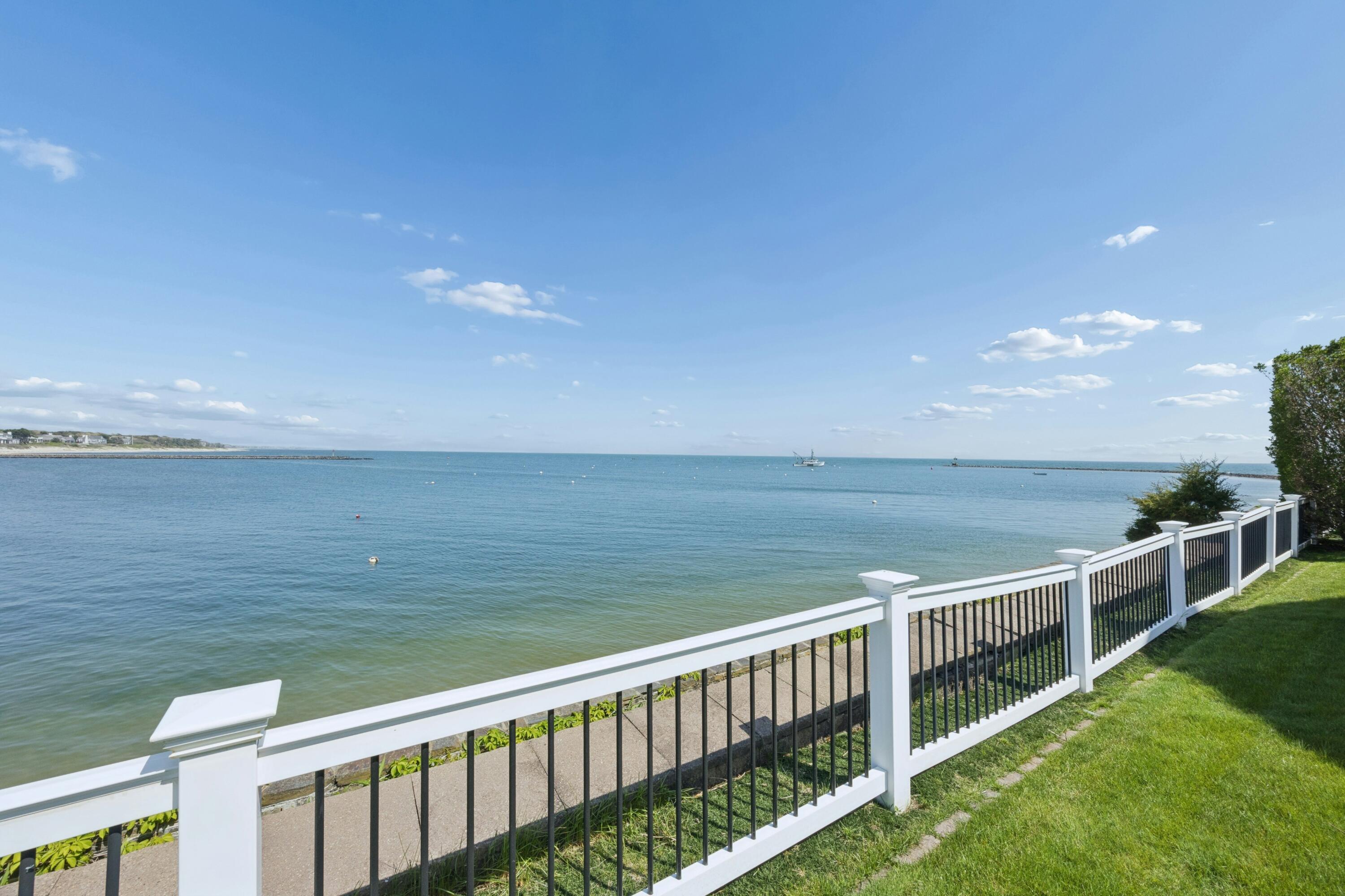 23 Snow Inn Road, Unit 7 Harwich Port, MA 02646 - Photo 1 of 37 a balcony with an ocean view