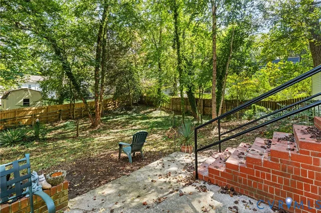 a view of a bench in a backyard