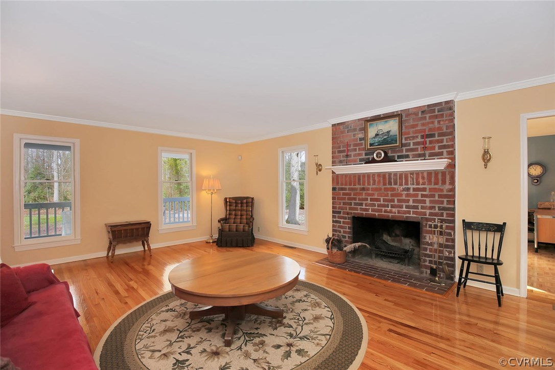 2203 Mt Blanco Road Chester, VA 23836 - Photo 7 of 27 a living room with furniture and a fireplace