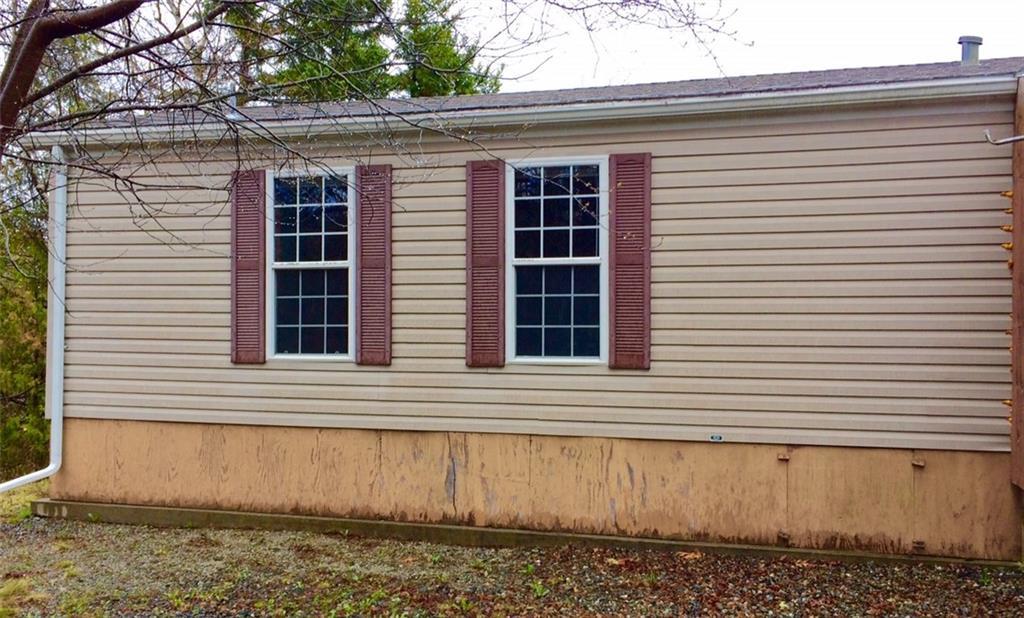 78 Cape Road Seal Cove, ME 04674 - Photo 6 of 24 Left, front, of the single wide part...