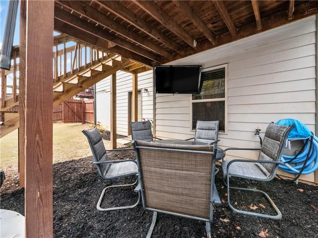a patio with table and chairs