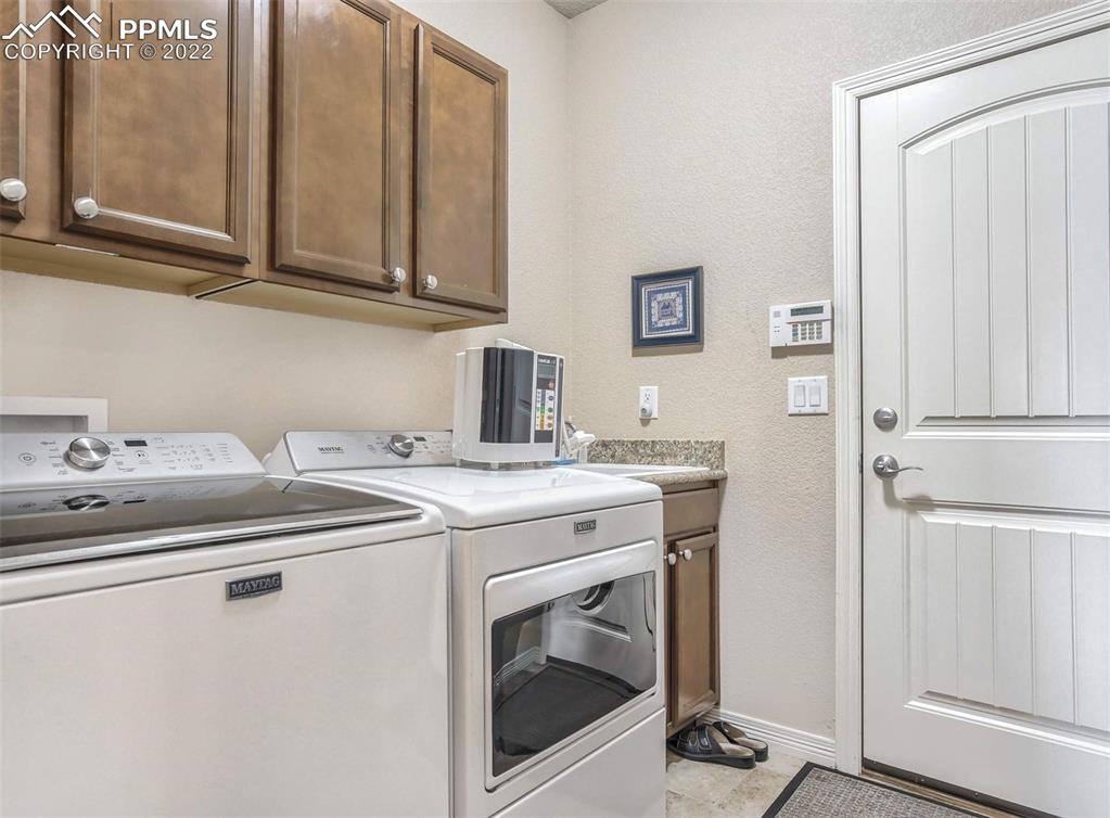 12410 Salmon Point Colorado Springs, CO 80921 - Photo 17 of 49 a utility room with dryer and washer