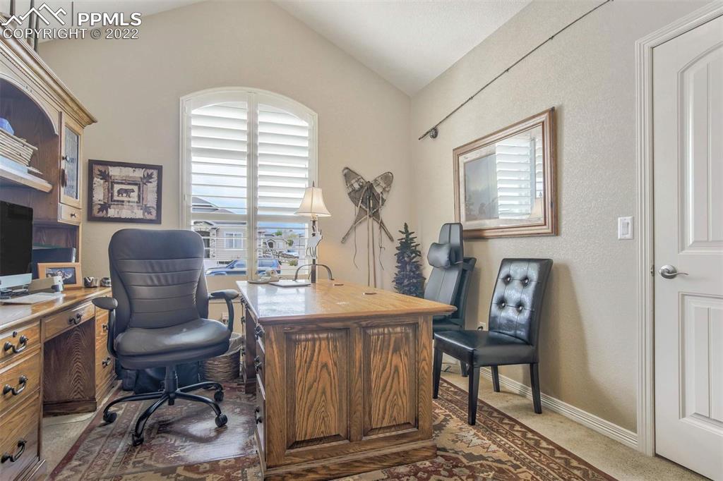 12410 Salmon Point Colorado Springs, CO 80921 - Photo 21 of 49 a view of a workspace with furniture and a window