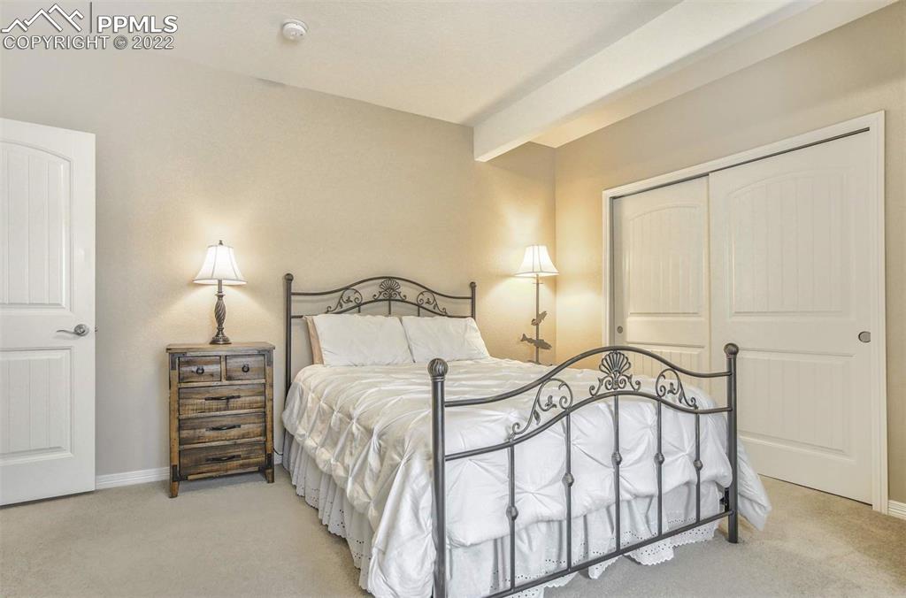 12410 Salmon Point Colorado Springs, CO 80921 - Photo 37 of 49 a bedroom with a bed and a night stand