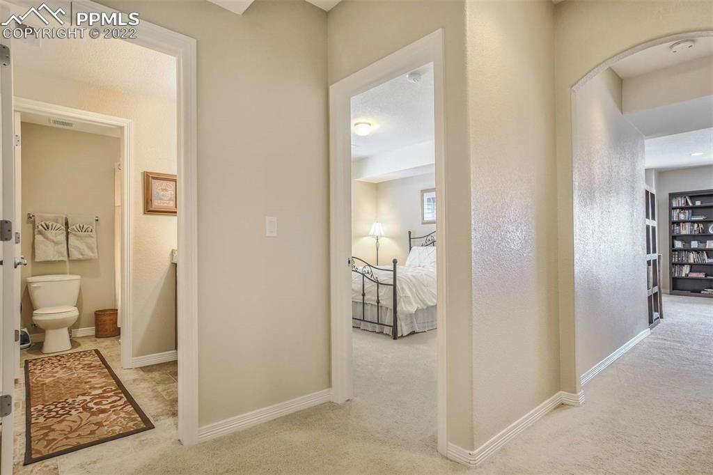 12410 Salmon Point Colorado Springs, CO 80921 - Photo 39 of 49 a view of a bathroom from a hallway