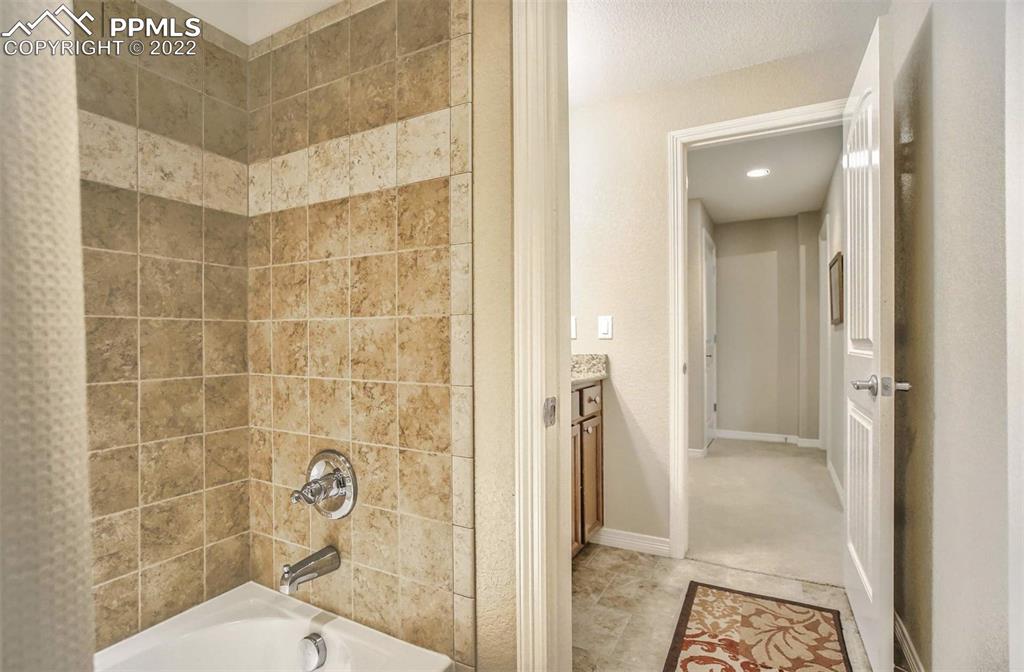 12410 Salmon Point Colorado Springs, CO 80921 - Photo 41 of 49 a bathroom with a shower and a sink
