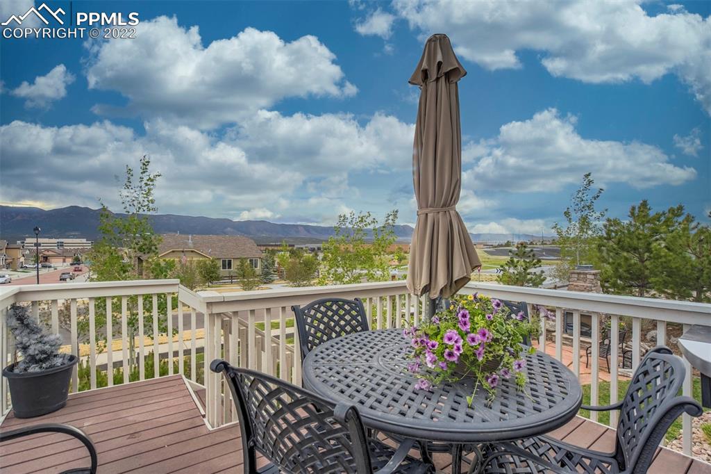 12410 Salmon Point Colorado Springs, CO 80921 - Photo 42 of 49 a view of a balcony with wooden floor
