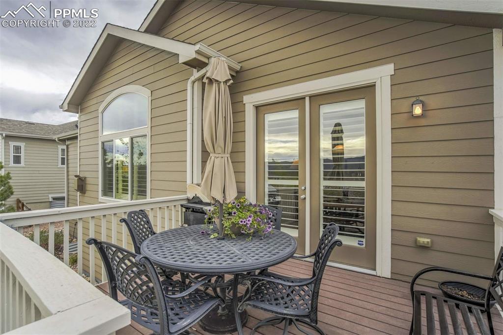 12410 Salmon Point Colorado Springs, CO 80921 - Photo 44 of 49 a balcony with table and chairs