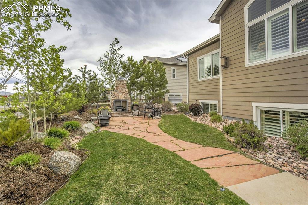 12410 Salmon Point Colorado Springs, CO 80921 - Photo 47 of 49 a view of a backyard with plants and large trees