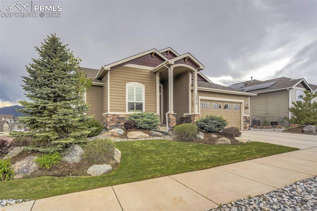 12410 Salmon Point Colorado Springs, CO 80921 - Photo 49 of 49 a front view of a house with a yard