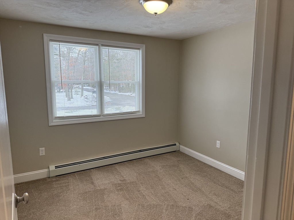 9 Rickard Street Carver, MA 02330 - Photo 13 of 26 an empty room with a window
