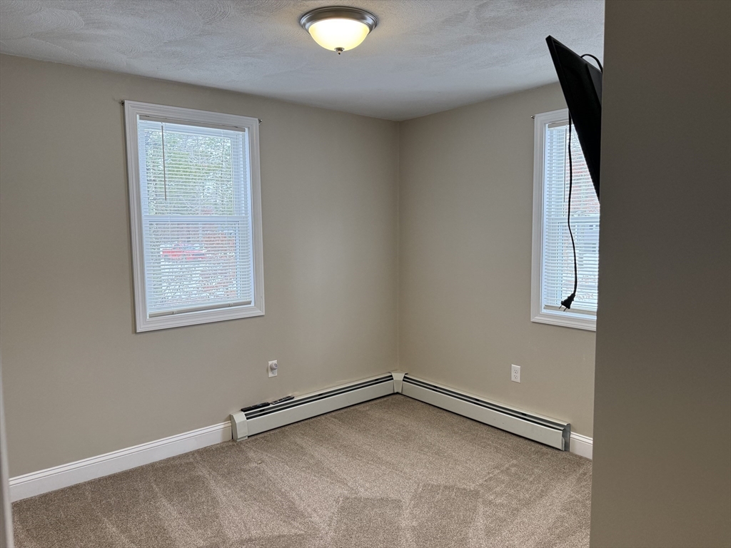 9 Rickard Street Carver, MA 02330 - Photo 14 of 26 an empty room with a window