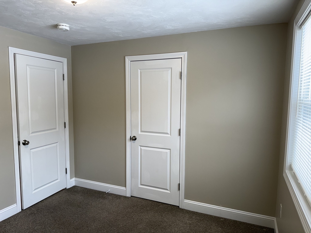 9 Rickard Street Carver, MA 02330 - Photo 15 of 26 an empty room with closet area