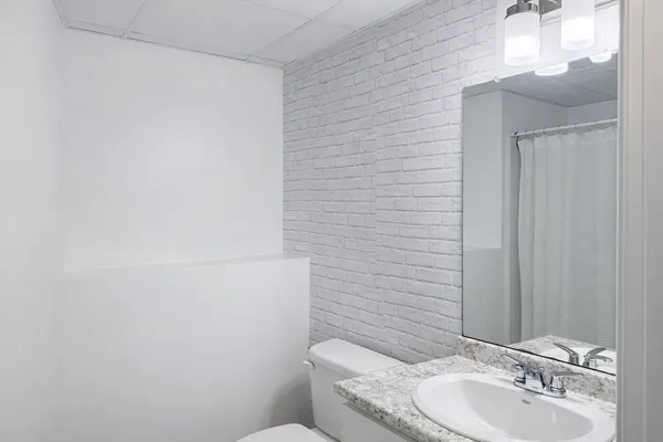 a bathroom with a toilet and sink