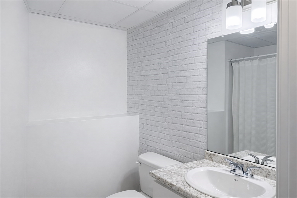 9 Rickard Street Carver, MA 02330 - Photo 17 of 26 a bathroom with a toilet and sink