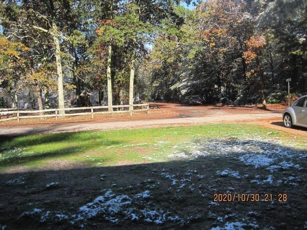 9 Rickard Street Carver, MA 02330 - Photo 26 of 26 a view of a yard with swimming pool and trees