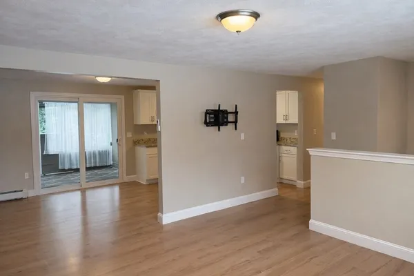 a view of a livingroom with wooden floor