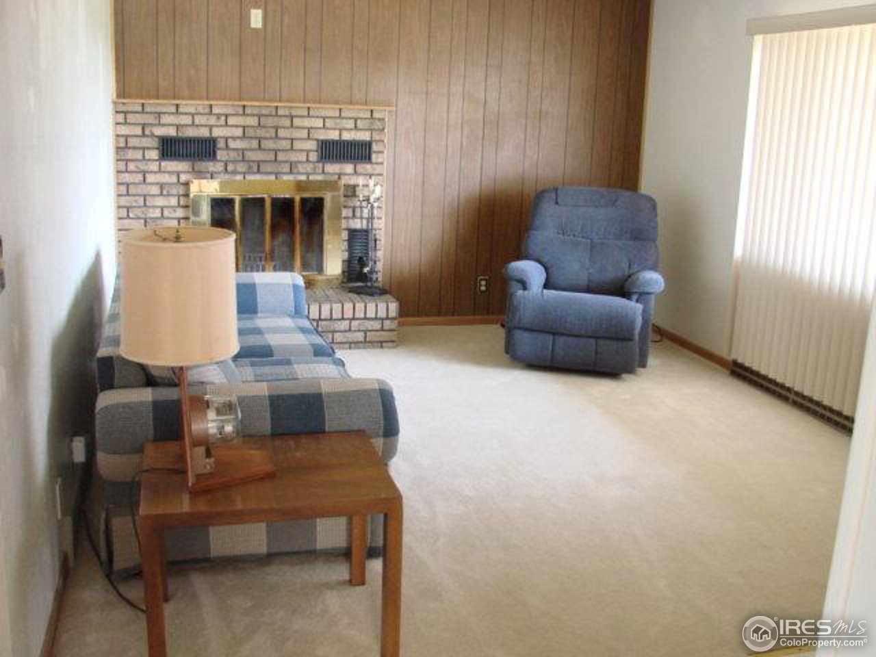 4433 County Line Road Erie, CO 80516 - Photo 4 of 11 a living room with furniture and a fireplace