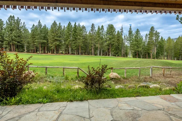 a dining room with furniture and a window