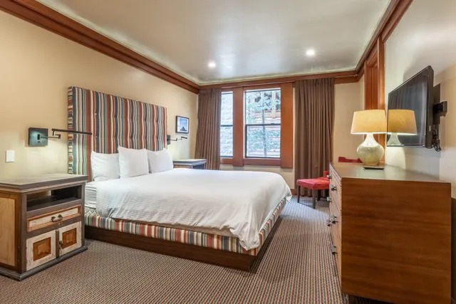 a view of a field with a tree in front of it