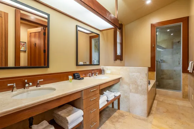 a spacious bedroom with a bed and a couch