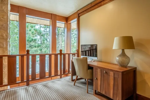 a view of a bedroom with furniture and a window