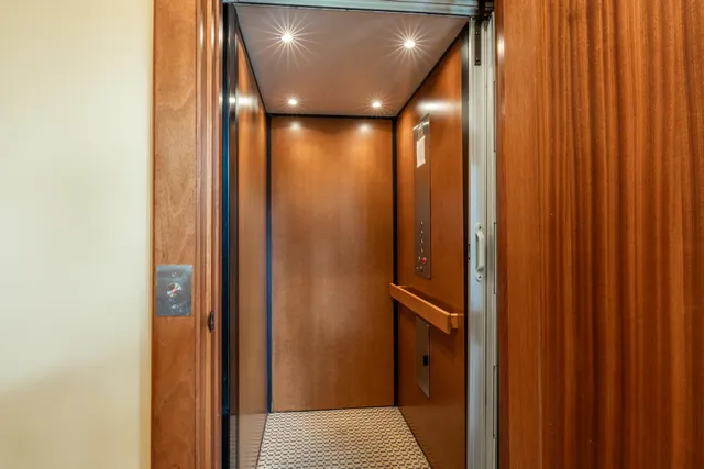 a view of a porch with wooden floor and outdoor seating