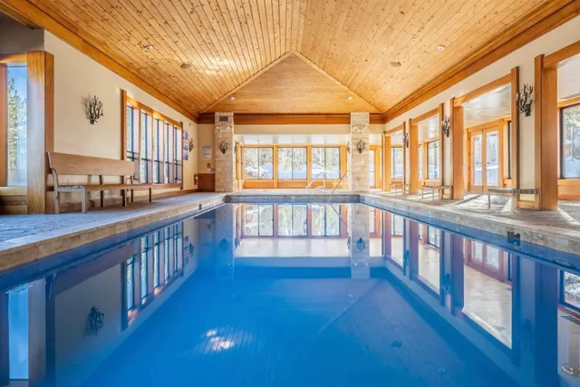 a living room with a couch and dining table