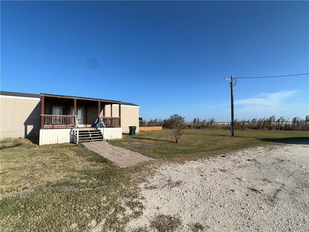 Undisclosed Address Robstown, TX 78380 - Photo 1 of 17 a view of a house with a yard