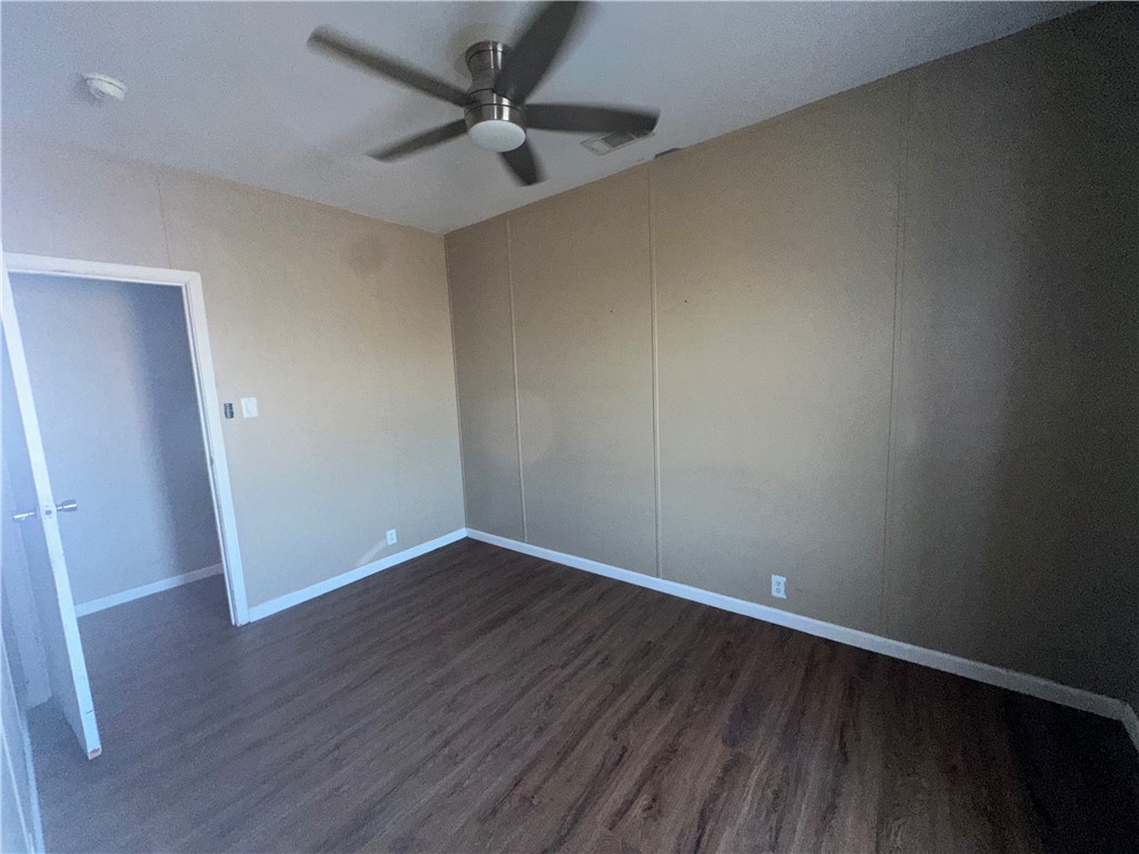 Undisclosed Address Robstown, TX 78380 - Photo 15 of 17 an empty room with wooden floor and windows