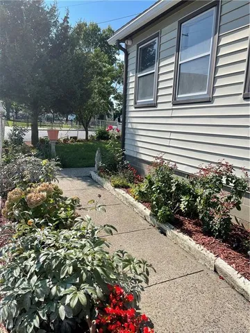 a view of backyard with sitting area