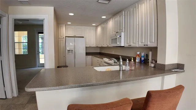 a kitchen with stainless steel appliances granite countertop a granite counter tops and a counter space