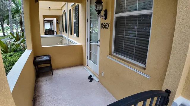 a view of balcony with a potted plant
