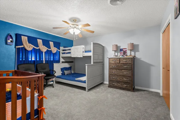 a bedroom with furniture and window
