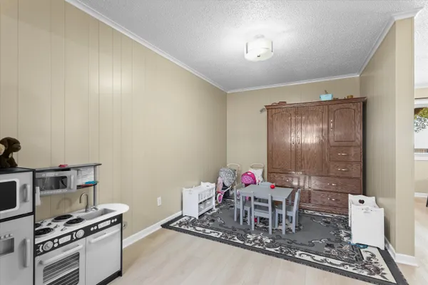 a dining room with furniture and a chandelier