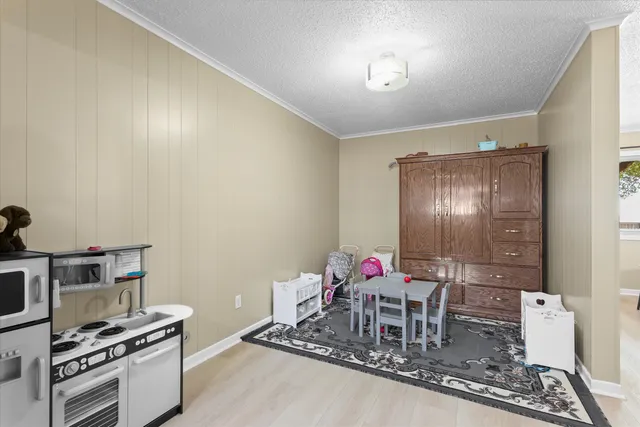 a dining room with furniture and a chandelier