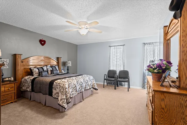 a bedroom with a bed and window