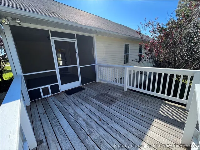 a view of balcony with wooden floor