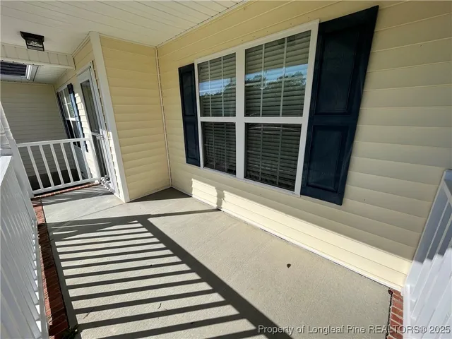 a view of a balcony with door