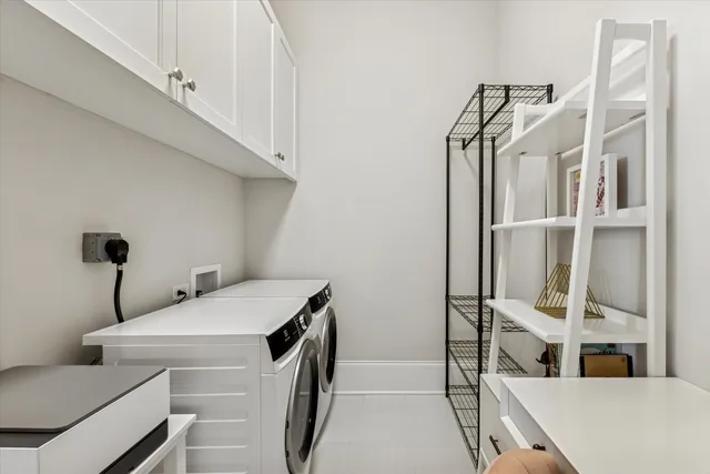 a view of storage and utility room with racks on the wall