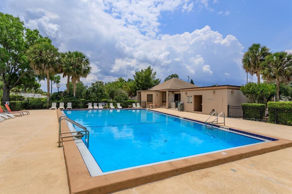 240 Orienta Point Street, Unit 240 Altamonte Springs, FL 32701 - Photo 19 of 20 a view of pool with lawn chairs and plants