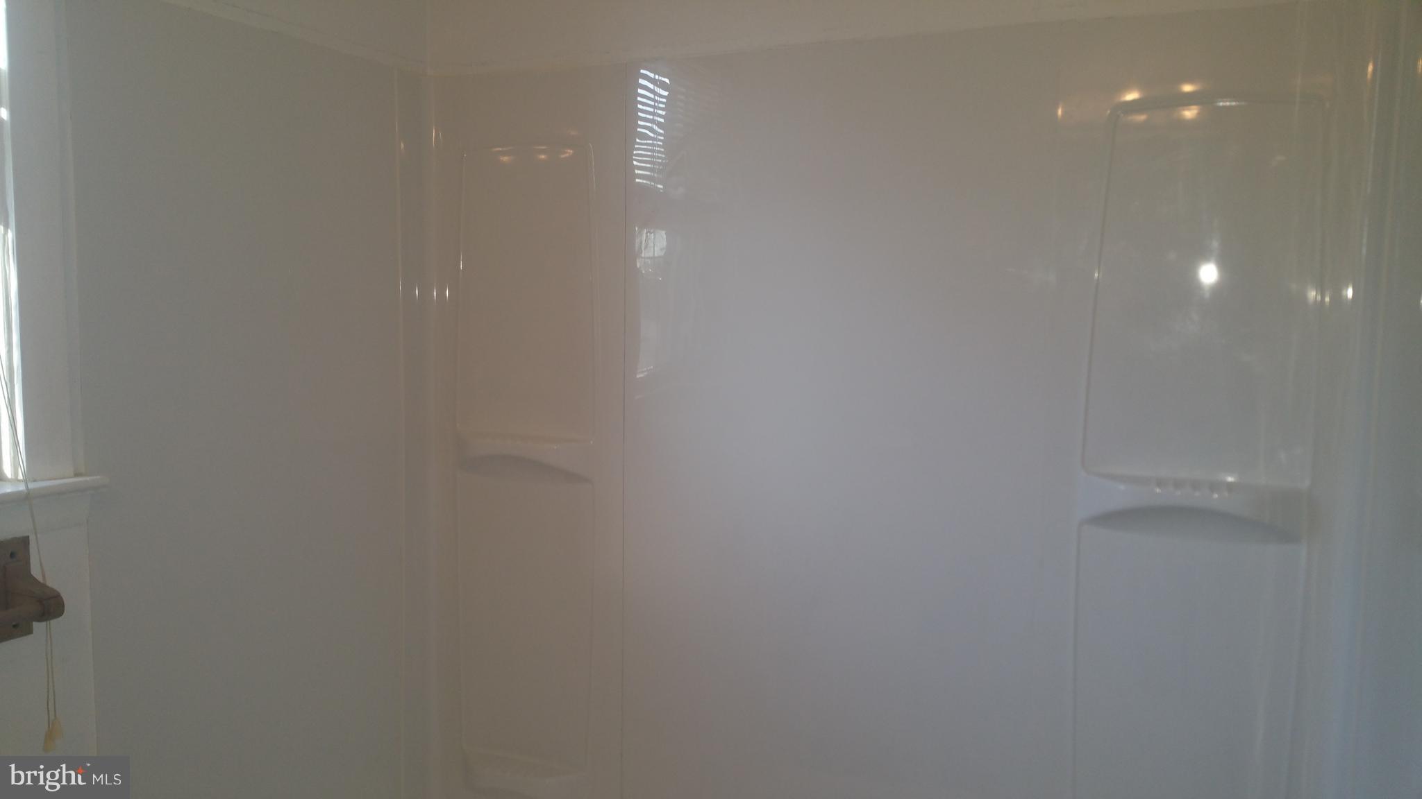 1640 Riverwood Road Essex, MD 21221 - Photo 16 of 22 Upstairs BA/tub surround