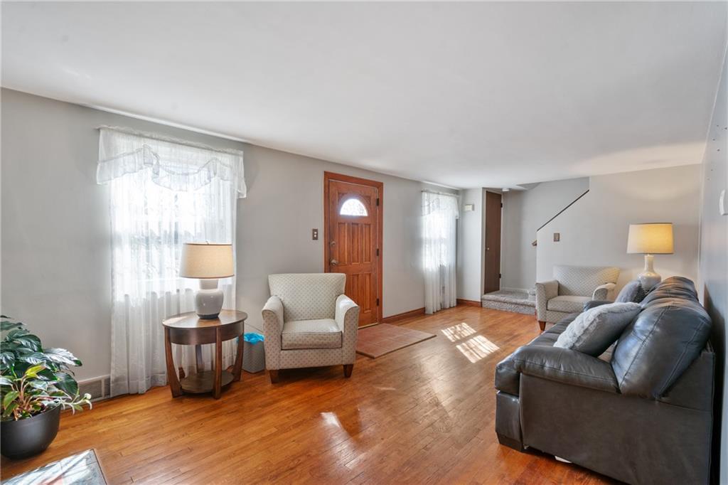 520 Nichols Road Pittsburgh, PA 15237 - Photo 3 of 31 a spacious bedroom with a bed and a couch