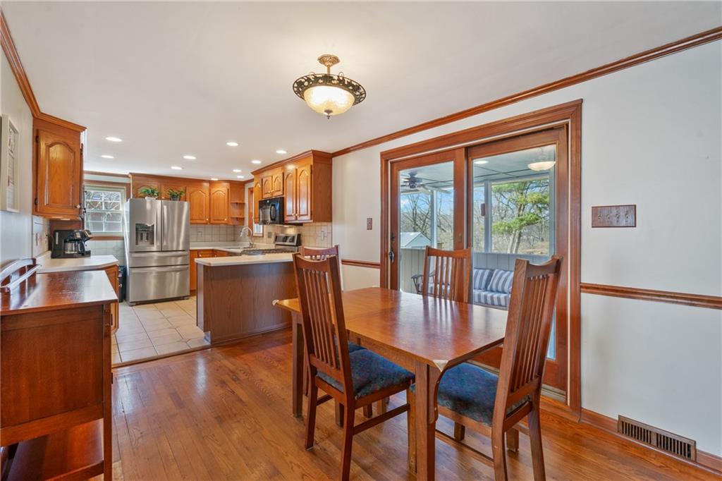 520 Nichols Road Pittsburgh, PA 15237 - Photo 7 of 31 a dining room with furniture a window and wooden floor