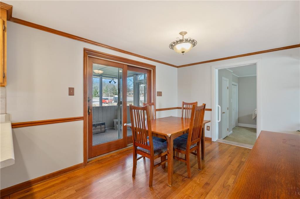 520 Nichols Road Pittsburgh, PA 15237 - Photo 8 of 31 a dining room with furniture a chandelier and wooden floor